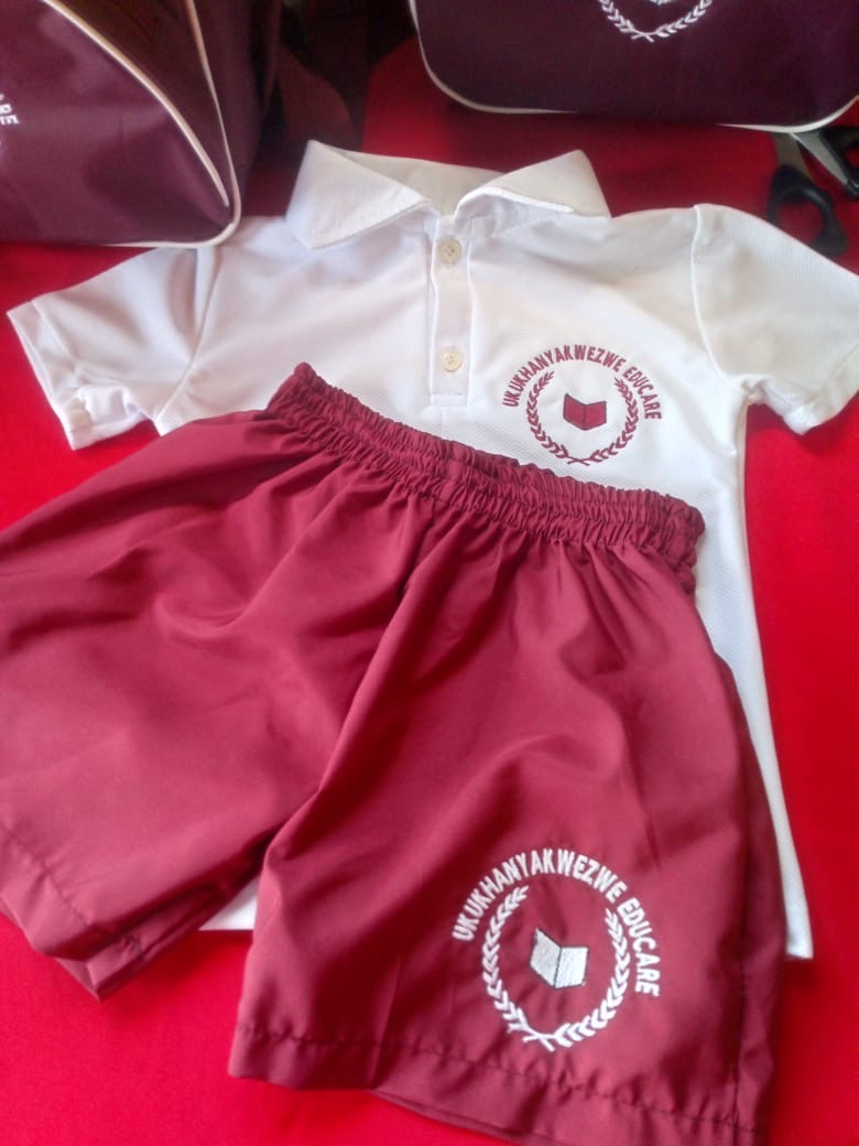Red and white school tracksuit and bag